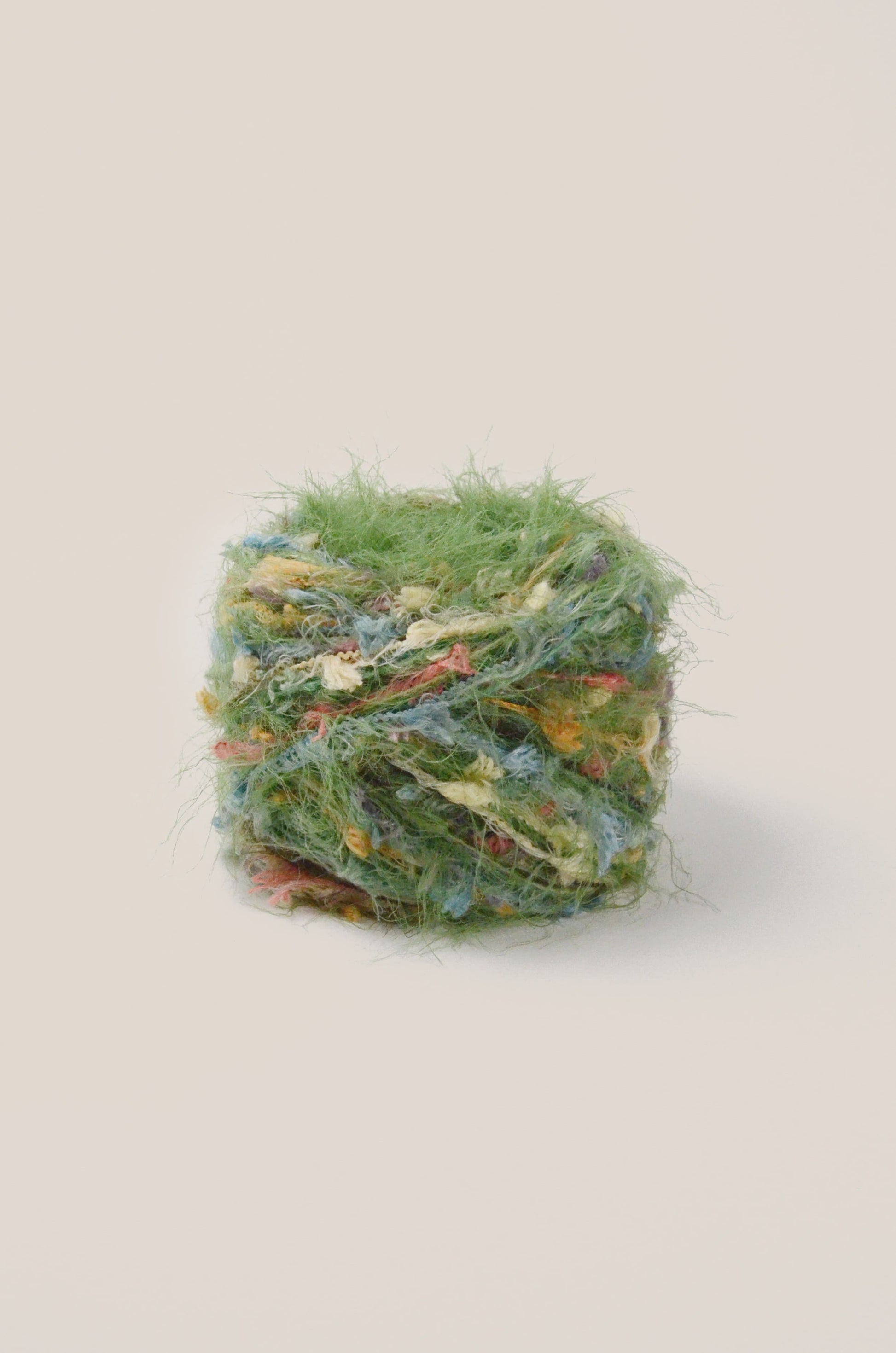 Christmas Tree hand-blended yarn – light forest green with bright multicolour threads, soft and fluffy texture inspired by woodland lights