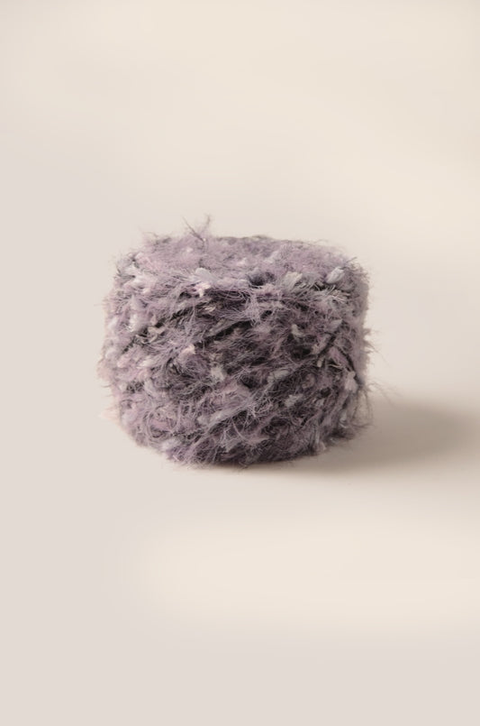 Lavender Mist hand-blended yarn – smoky purple base with black and grey accents, soft and fluffy texture, inspired by night-blooming flowers